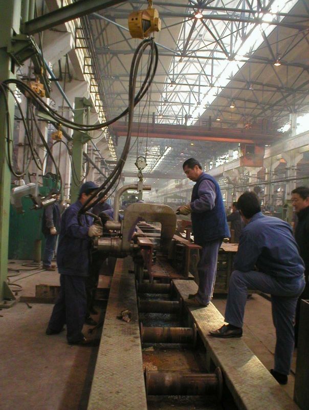Mid beam riveting machine